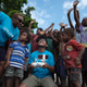 Children in Vanuatu watch a drone operator